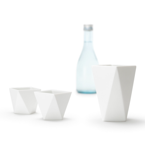Japanese white porcelain sake set including a bottle and two cups