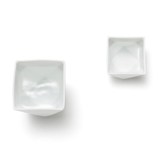 Japanese white porcelain sake set including a bottle and two cups