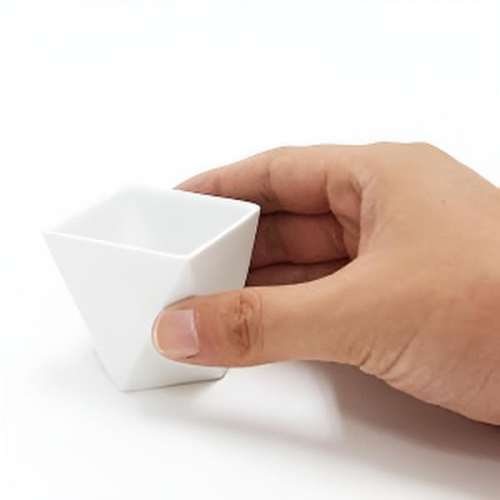 Japanese white porcelain sake set including a bottle and two cups