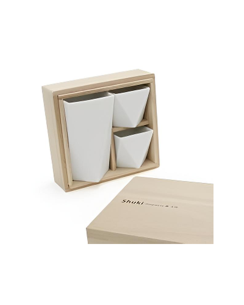 Japanese white porcelain sake set including a bottle and two cups