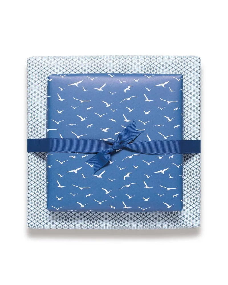 Double-sided gift wrapping paper with two matching patterns