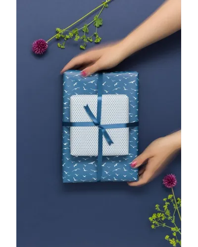 Double-sided gift wrapping paper with two matching patterns