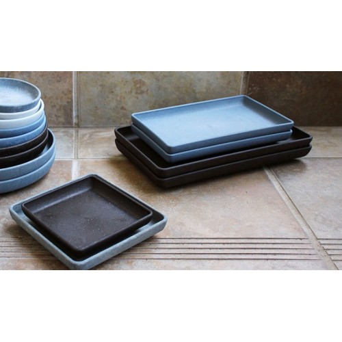 square and rectangular plastic saucers in various colors and sizes
