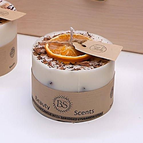 Small Orange & Cinnamon Scented Candle With Shredded Cinnamon.